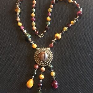 Really pretty beaded necklace in earth tones.